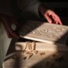 Woman opening wooden jewellery box